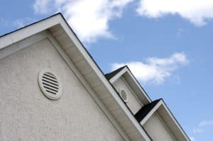 Close up of roof peaks against blue sky